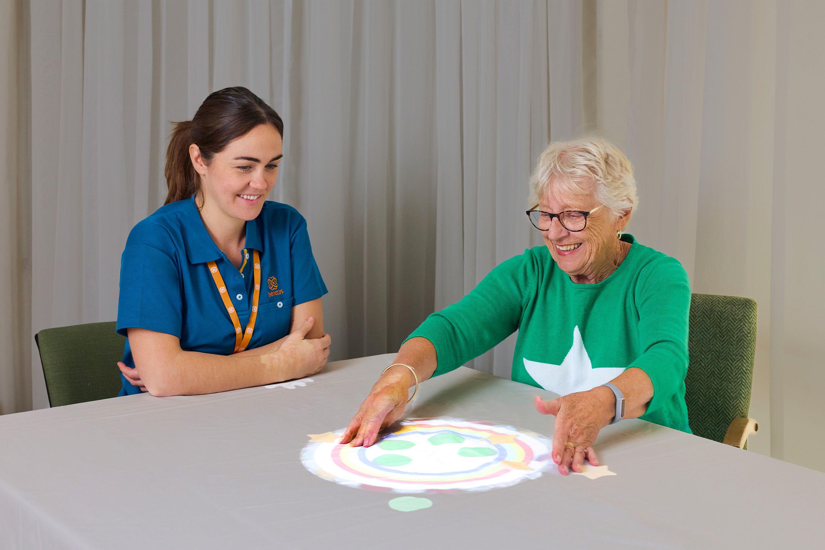 Resident and Benetas team member participating in a sensory activity at Benetas Kangaroo Flat
