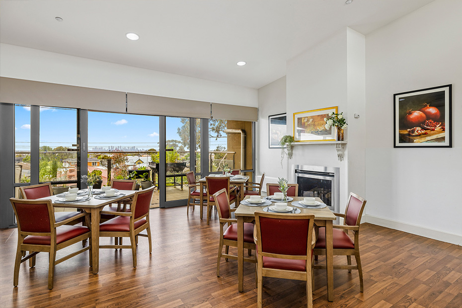 Colton Close dining room overlooking the cityscape, offering a breathtaking view of the urban landscape.