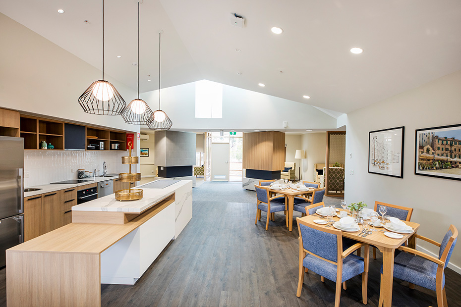 A kitchen with a table and chairs, providing a beautiful space for dining and gathering.